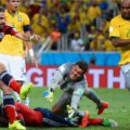 Intense moment at one of the best soccer tournaments in the world, showing a goalkeeper and players in a dynamic play on the field.