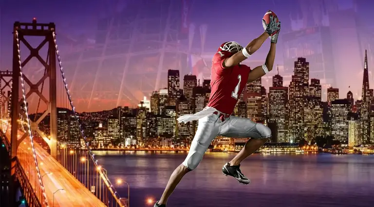 A football player in a red jersey makes a leaping catch against a backdrop of an illuminated city skyline and a bridge, highlighting an energetic football travel and event scene.
