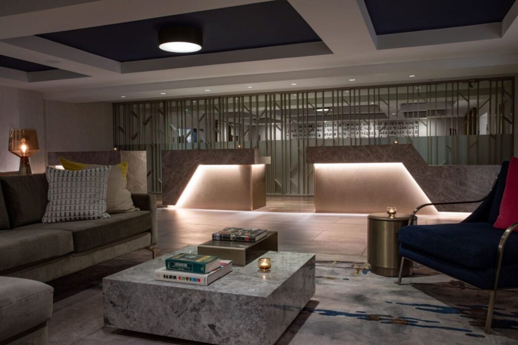 Luxurious lobby space at Hotel Dena in Pasadena, featuring modern interior design and cozy seating, near the Rose Bowl event.