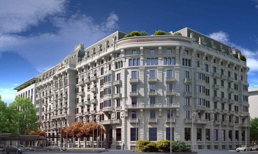 Sunlit view of the elegant Excelsior Hotel Gallia in Milan, showcasing its ornate facade, ideal for guests visiting the Italian Grand Prix in the Monza area.
