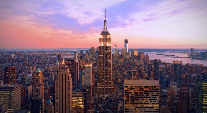 Sunset view of Manhattan showcasing the Empire State Building, highlighting the city as the venue for the US Open, related to the New York Area Map.