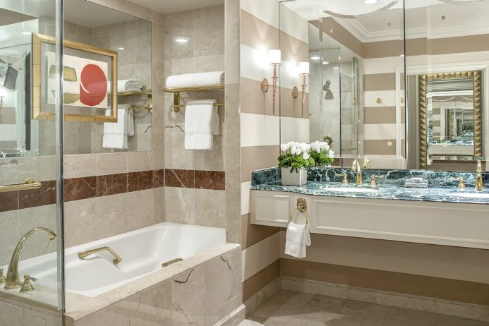 Luxurious bathroom with marble finishes and modern amenities at The Venetian Resort in Las Vegas, ideal for guests attending the Las Vegas Grand Prix.
