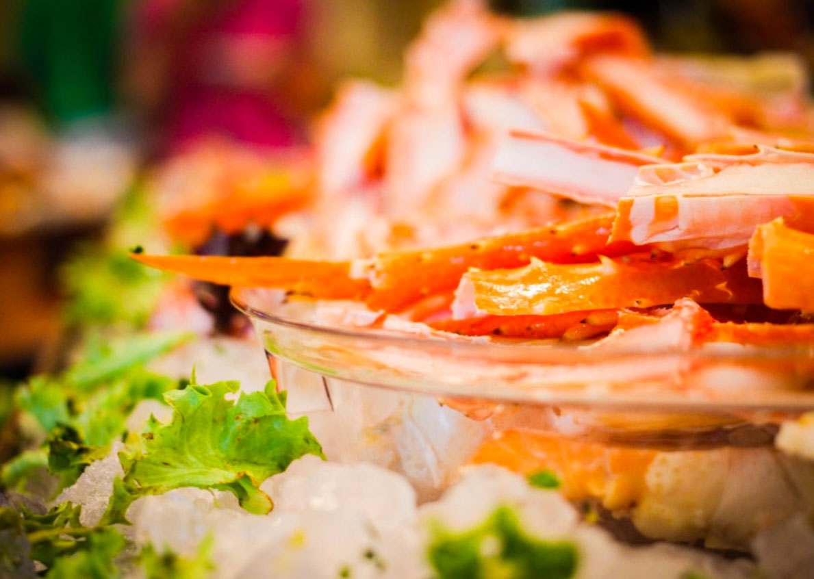Close-up view of a crab meat dish in a glass bowl, presented as part of a premium hospitality package at the Masters Golf Tournament in Augusta.