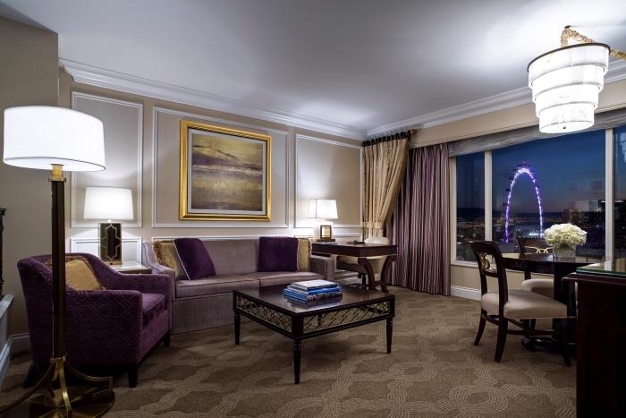 Luxurious hotel room at The Venetian Resort in Las Vegas, featuring elegant furniture, classic decor, and a view of the High Roller observation wheel from the window.
