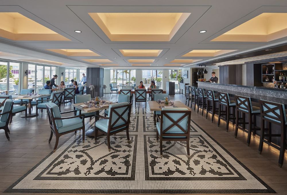 Inside the elegant Mandarin Oriental at 5 Raffles Avenue, Singapore, diners enjoy fine dining at the sophisticated Dolce Vita restaurant, ideal for guests visiting for Singapore Grand Prix.