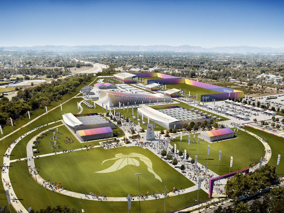 Aerial view of a spacious, colorful event venue in Los Angeles, bustling with visitors, set up for the Summer Games, featuring various tents and banners promoting the event.