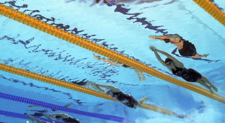 Swimmers compete in a pool at the Summer Games, a key event for Summer Games Travel Packages that lets you connect with and discover premiere sports competitions.