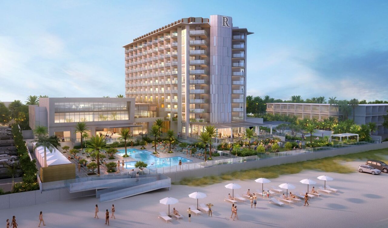 Illustration of the Renaissance Daytona Beach Oceanfront Hotel, showing a multi-story building with balconies, a pool area, and beach access, bustling with people enjoying the sunny setting.