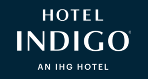 Hotel Indigo logo, featuring the name in white capital letters on a navy background, indicating it's part of the IHG hotel brand.