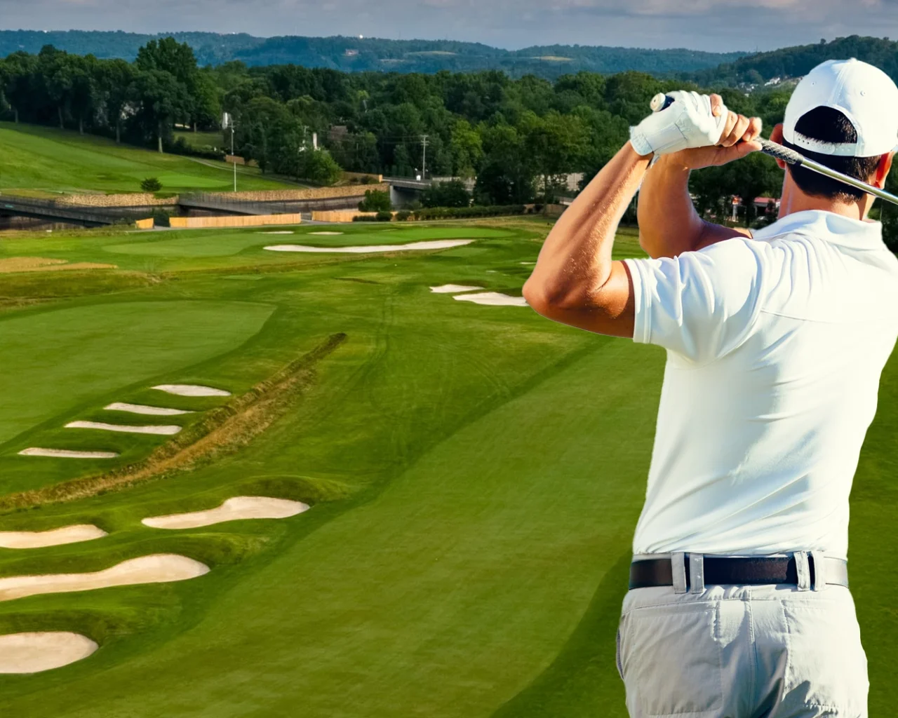 A golfer plays a shot on the fairway at the scenic Oakmont Country Club in Pittsburgh, perfect for those looking into golf travel and hotel packages.