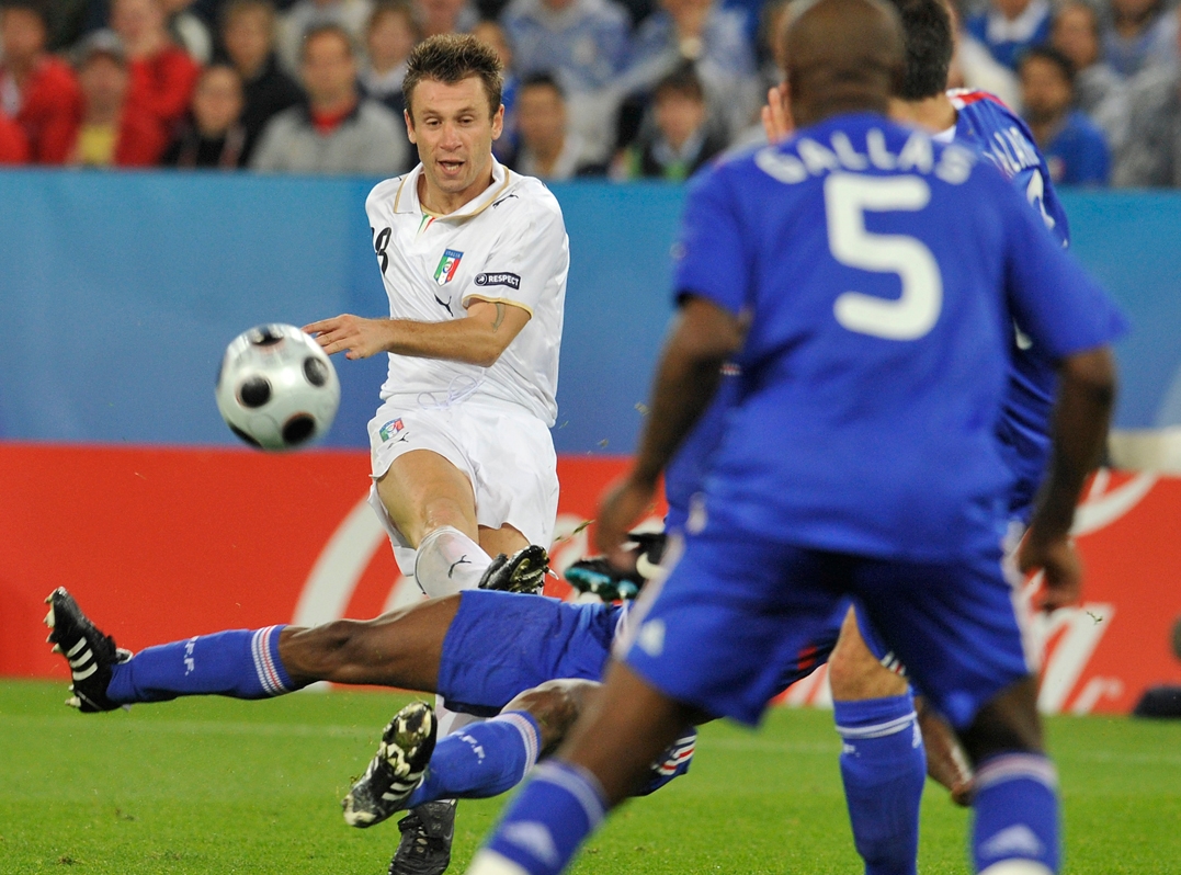 Soccer players in action during a match, with one player in a sliding tackle and another controlling the ball, hinting at the excitement of the Club World Cup Opening Match in Miami.