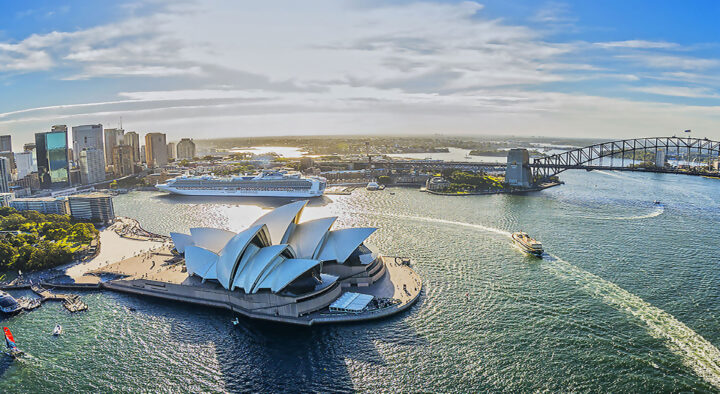 Aerial view of Sydney Harbour featuring the iconic Sydney Opera House and Harbour Bridge, perfect for visitors planning to attend the Custom World Cup of Rugby in Australia.