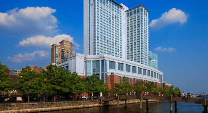 Modern hotel located near the waterfront, serving as a potential accommodation option for visitors attending the Preakness Stakes at Pimlico Race Course in Baltimore.