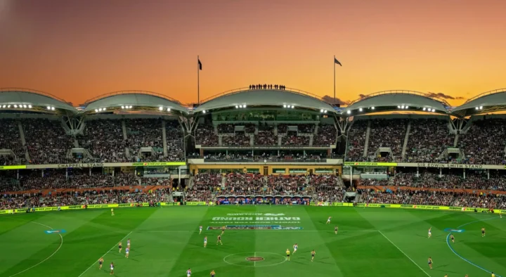 Sunset over Adelaide stadium during a packed event, showcasing one of the host venues for the Rugby World Cup.