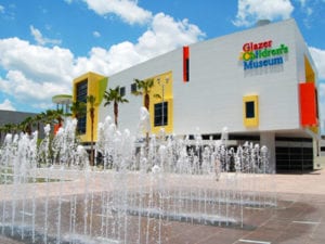 Bring the kids to the Glazer Childrens Museum in Tampa, colorful building, outdoor water displays.