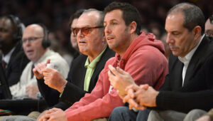 Celebrities Jack Nicholson and Adam Sandler enjoying a Lakers game