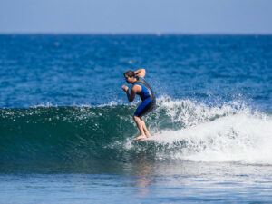 A surfer surfing the waves in Malibu