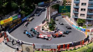 Formula 1 cars navigating the hairpin at the Monaco Grand Prix